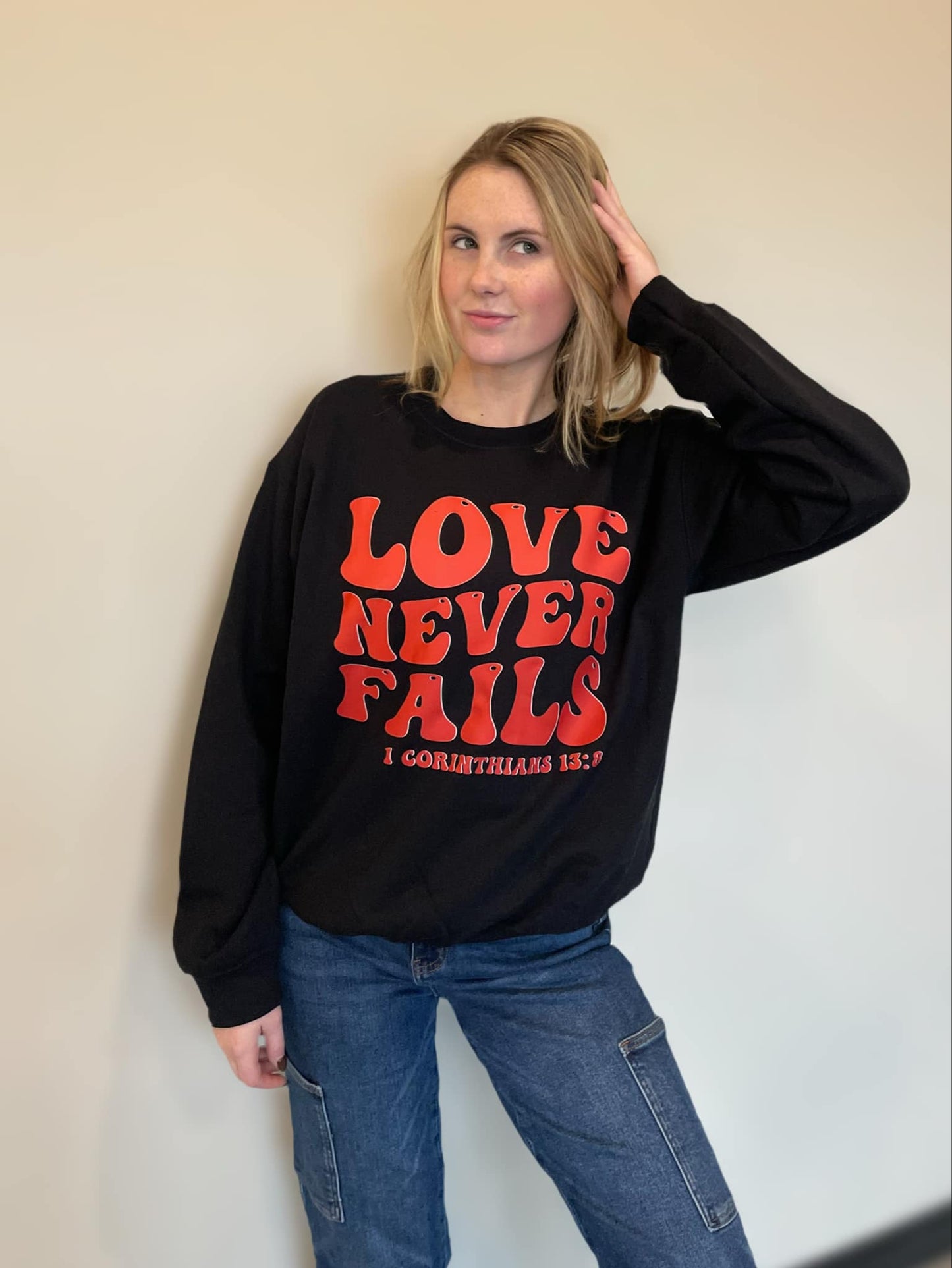 Love Never Fails Sweatshirt