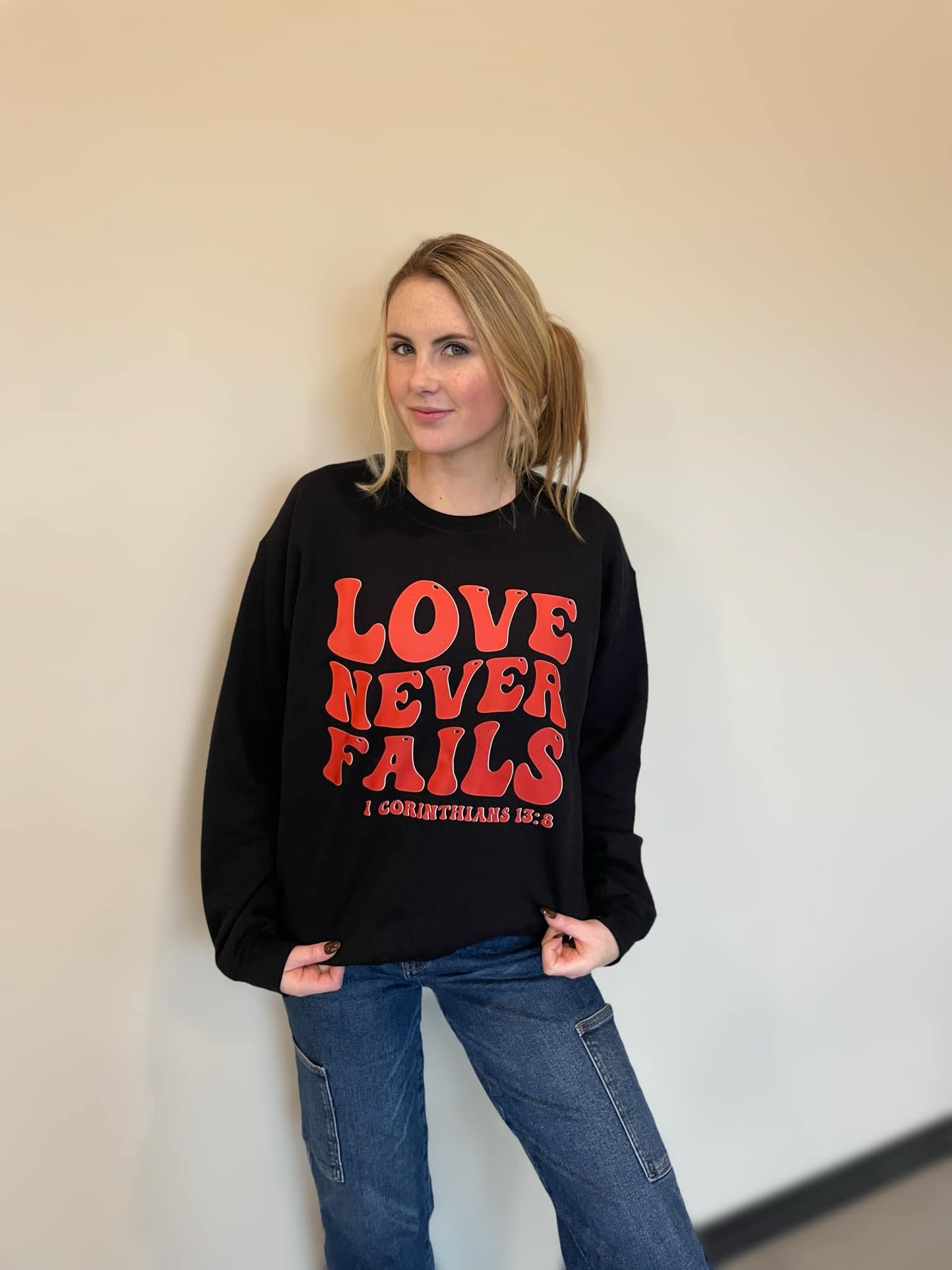 Love Never Fails Sweatshirt